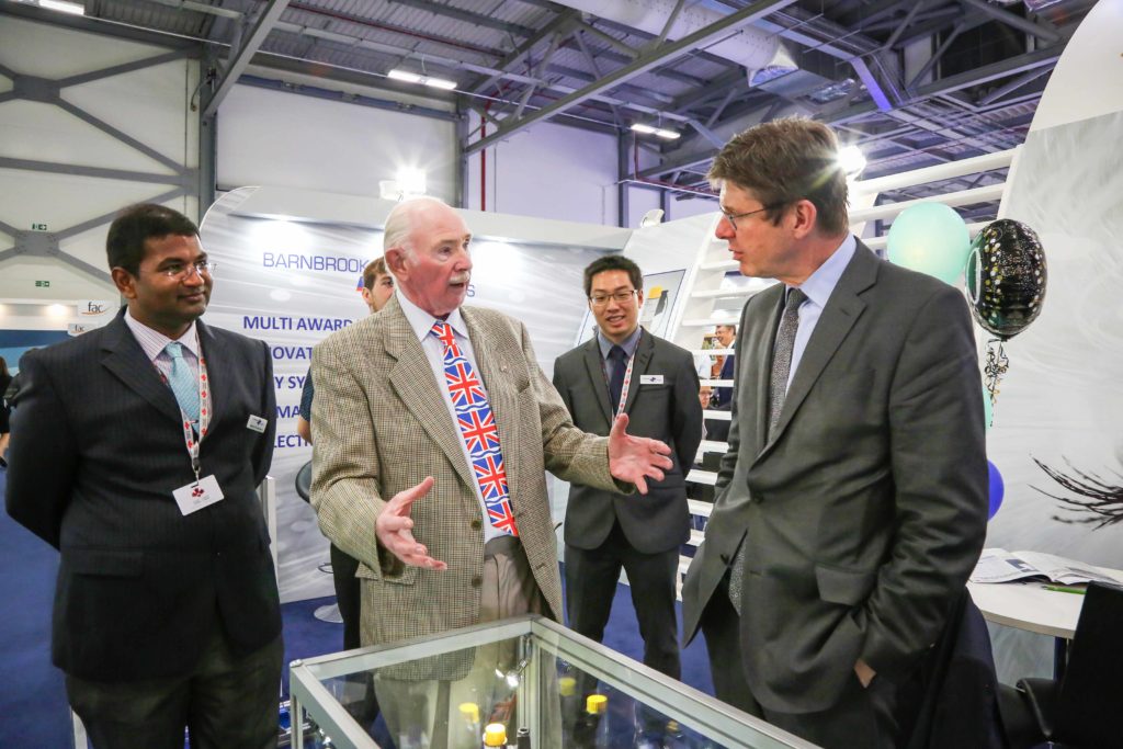 LIFT OFF: Barnbrook Systems Ltd managing director Tony Barnett (centre) welcomes then Business Secretary Greg Clark to the company's stand at the 2018 Farnborough International Air Show watched by quality manager Vic Gunesekaran